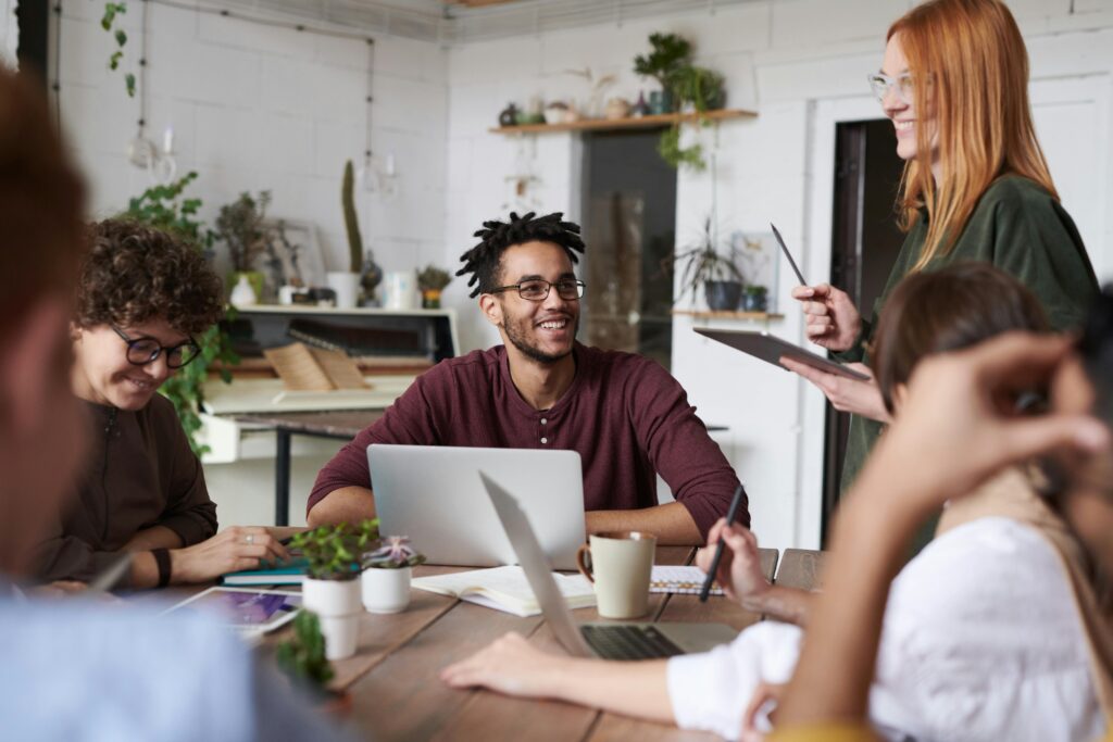 A creative workspace with a laptop, business strategy charts, and eco-friendly product samples, representing innovative small business ideas for 2025.