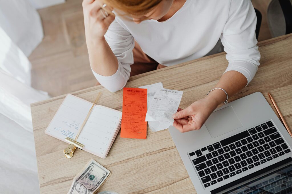 A blogger working on a laptop, monetizing their blog through affiliate marketing, ads, and digital products in 2025.